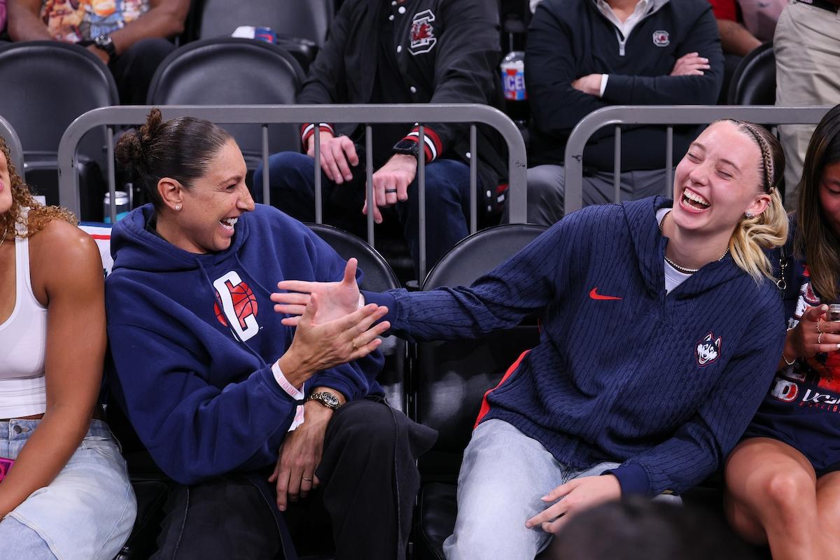 DT and Paige sitting courtside for UConn/South Carolina